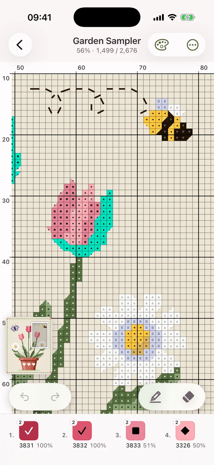 The same cross-stitch pattern on iPhone, zoomed in so each square's symbol can be read